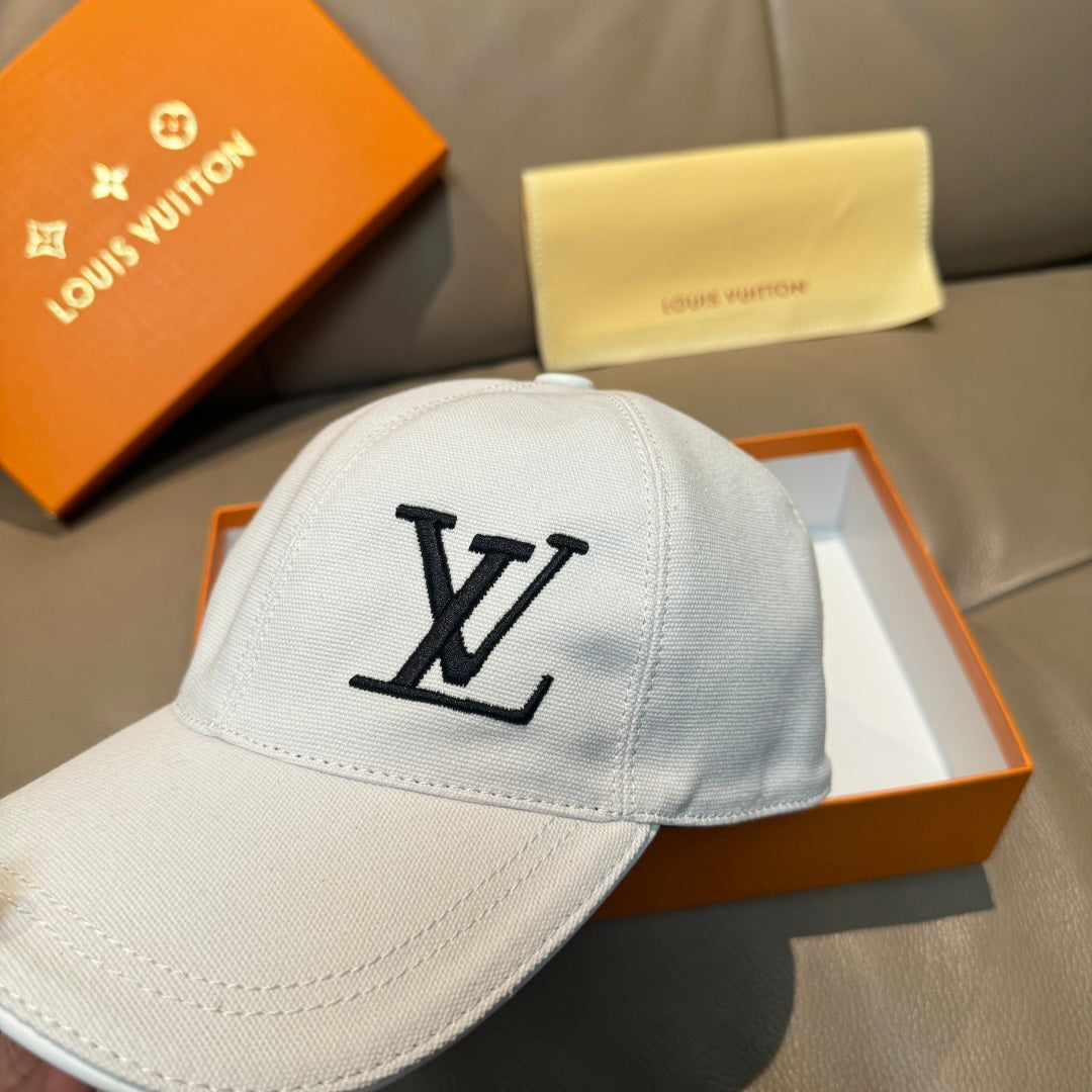 White Louis Vuitton cap with large black LV logo centered on front