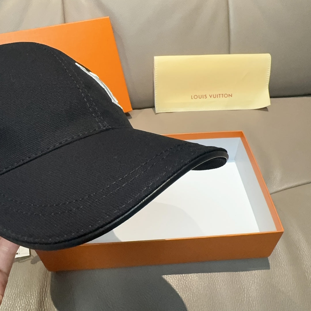 Black Louis Vuitton baseball cap side view with stitched paneling, curved brim.