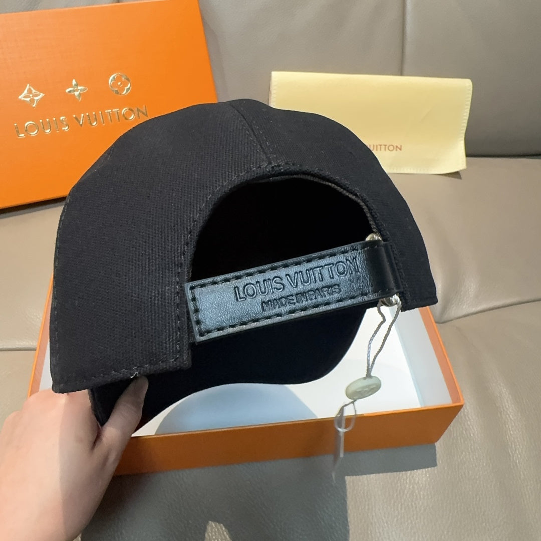 Black Louis Vuitton cap with interior adjustable strap labeled Louis Vuitton.