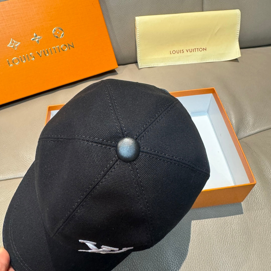 Black Louis Vuitton baseball cap from back, button top and curved brim.