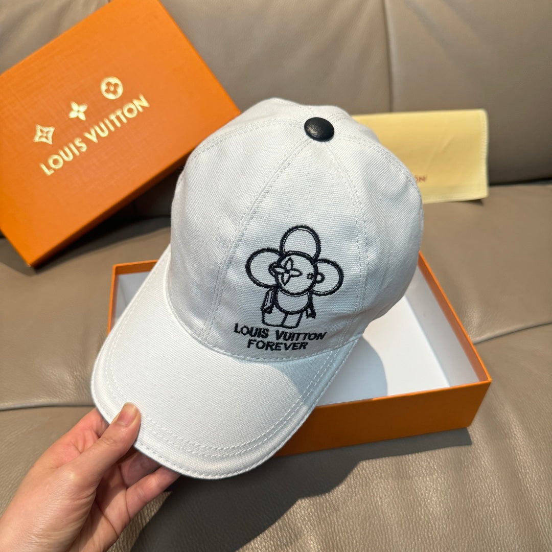 Louis Vuitton white cap close-up with black flower emblem and 'FOREVER' text