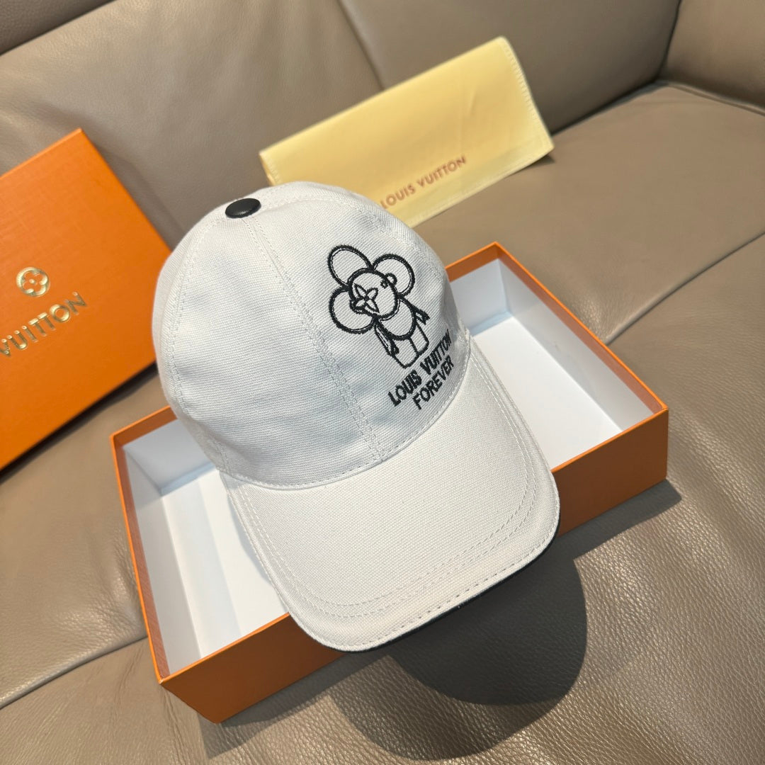 Louis Vuitton white cap with black flower logo and embroidered text