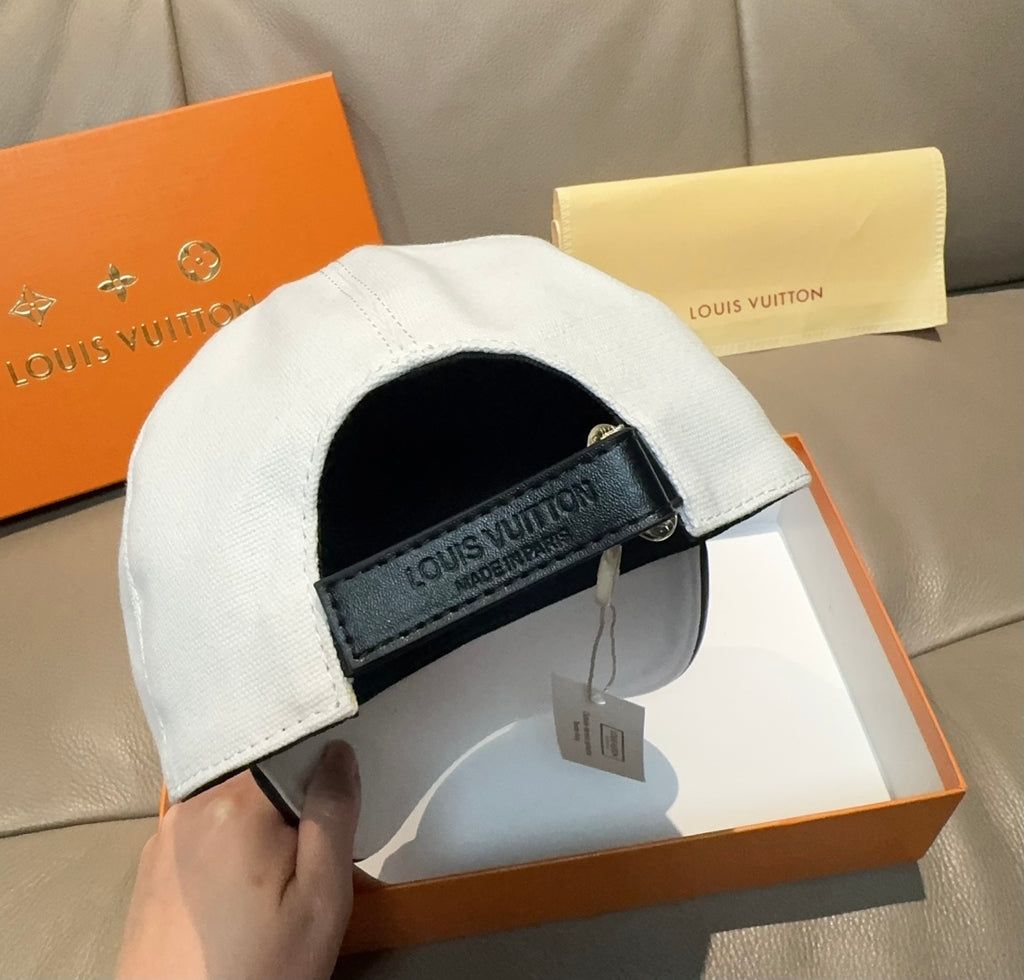 Louis Vuitton white cap interior view with black strap patch and hanging label