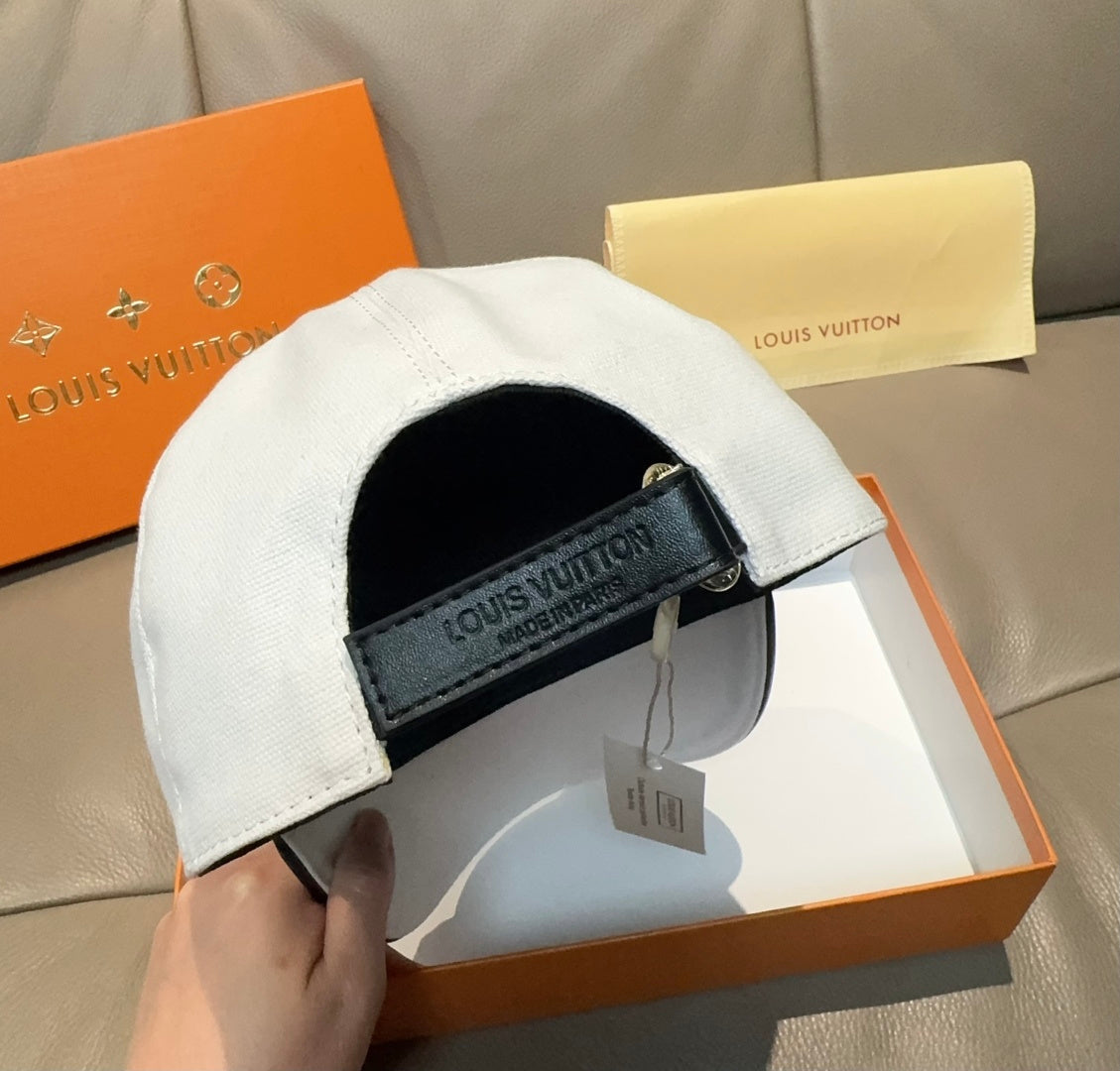 Louis Vuitton white cap interior view with black strap patch and hanging label