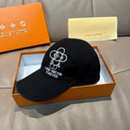 Louis Vuitton cap, black with embroidered Mickey-style flower logo and 'Forever' on front