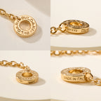 Bvlgari gold-tone charm bracelet with round engraved logo charms