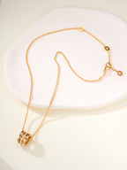 Gold chain necklace with round hoop pendant and link chain