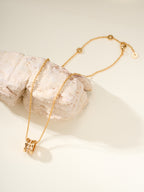 Gold chain necklace with small hoop pendant and lobster clasp
