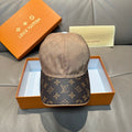 Louis Vuitton two-tone baseball cap with beige top and dark monogram brim.