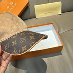 Louis Vuitton two-tone baseball cap side view with dark monogram panels and beige crown.