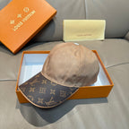 Louis Vuitton two-tone baseball cap with beige crown and dark monogram brim, front view.