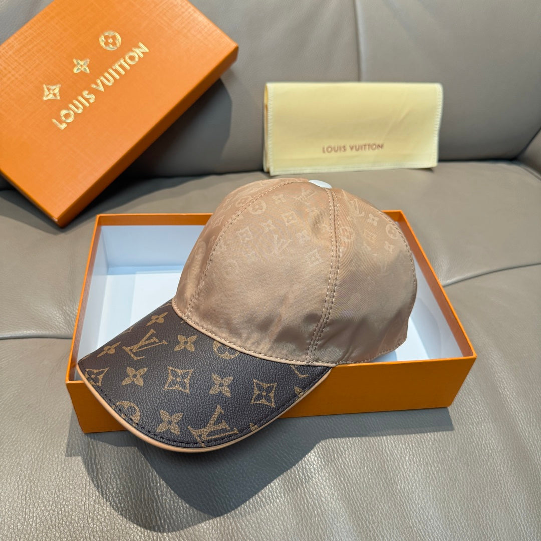 Louis Vuitton two-tone baseball cap with beige crown and dark monogram brim, front view.