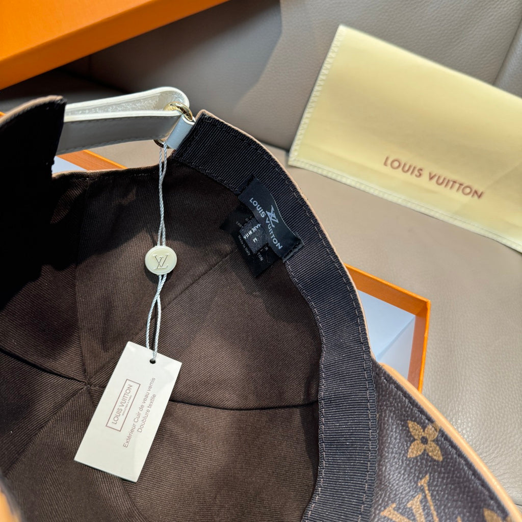 Louis Vuitton cap interior with dark fabric strap and attached size tag.