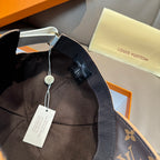 Louis Vuitton cap interior with dark fabric strap and attached size tag.