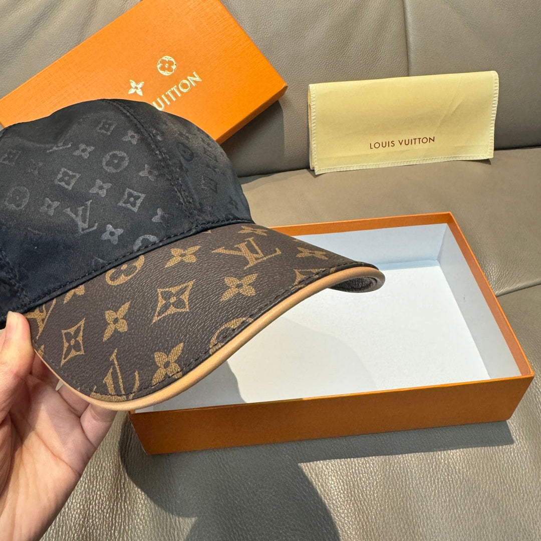 Louis Vuitton baseball cap with brown logo brim and dark monogram crown, side view.