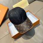 Louis Vuitton baseball cap with dark monogram top and brown logo brim, curved profile.