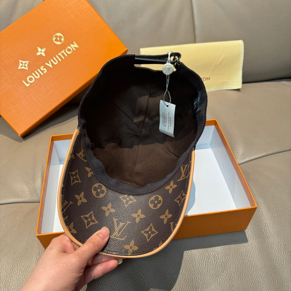 Louis Vuitton baseball cap interior view with dark lining and brown logo side panels.