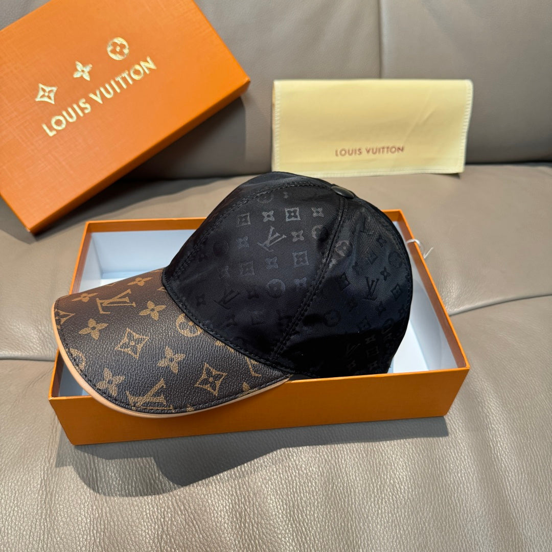 Louis Vuitton baseball cap with dark monogram crown and brown logo brim, angled view.