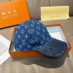 Blue monogram denim baseball cap with curved brim and stitched detail