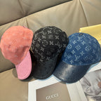 Set of three monogram caps in pink, black, and blue denim with curved brims