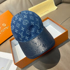 Blue monogram denim baseball cap with curved brim and round snap button
