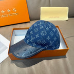 Blue monogram denim baseball cap with curved brim and subtle raised pattern