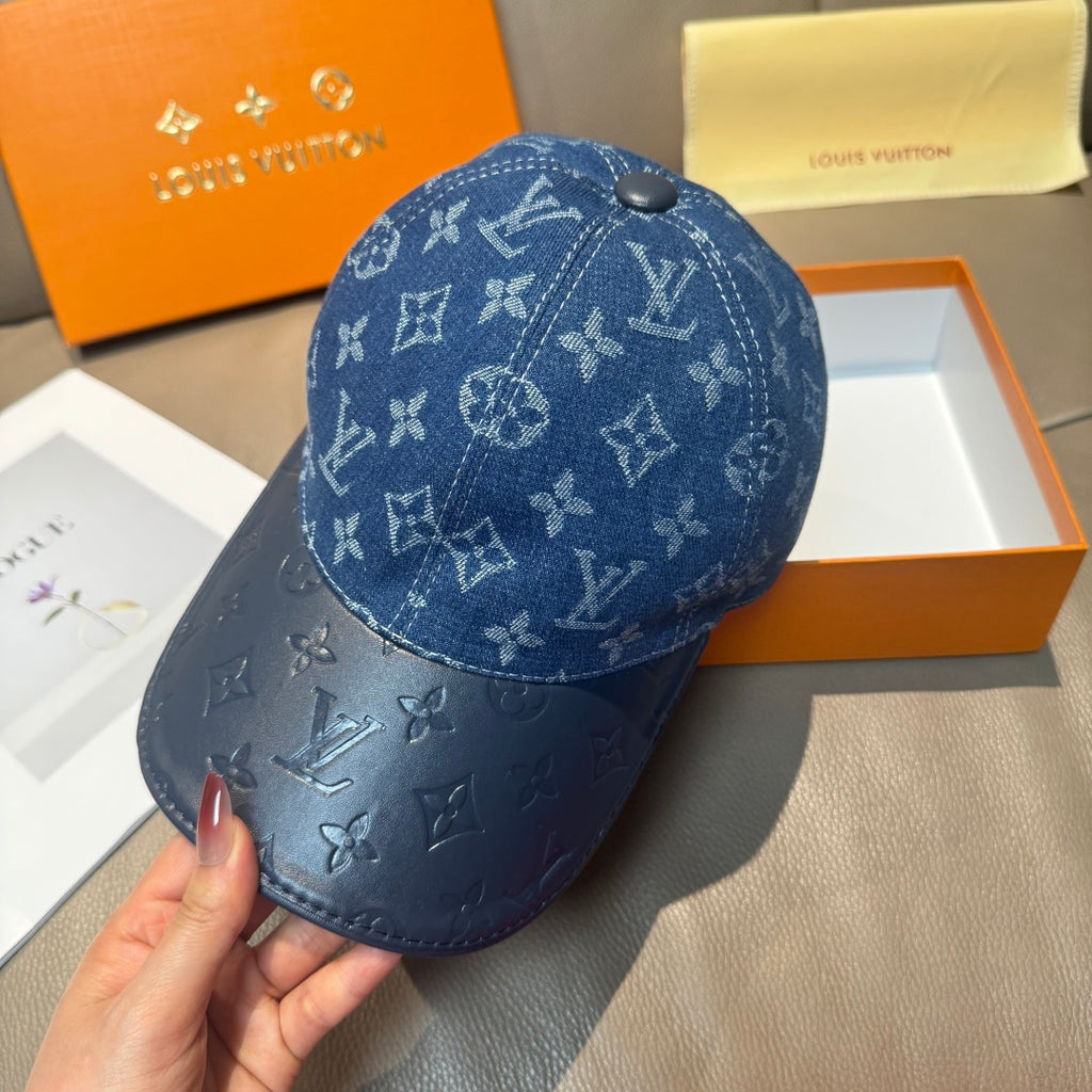 Blue monogram denim baseball cap in side view with curved brim and stitching