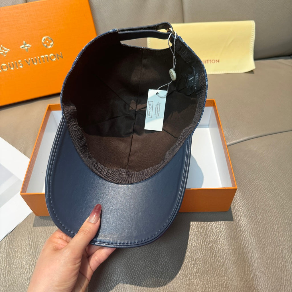 Navy monogram denim cap turned inside out, showing inner lining
