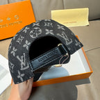 Louis Vuitton monogram cap with black adjustable strap and stitched logo band