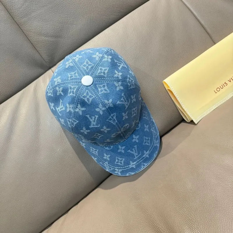 Blue monogram baseball cap with round top button and curved brim
