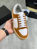 Brown suede and white lace-up sneakers with off-white sole and SAINT LAURENT branding.