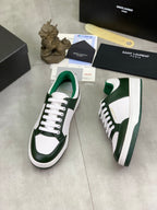 Luxury shoes in white and dark green with white laces and visible side branding
