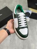 Luxury shoes in white and dark green leather with green lining and white laces
