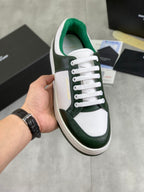Luxury shoes in white and dark green leather with green lining and white laces