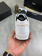 White low-top sneakers back view with black interior lining