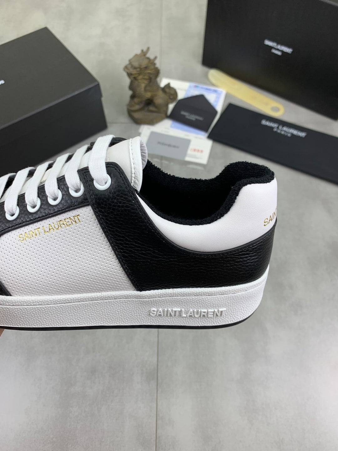 YSL unisex sneaker side, white leather with black panel, white laces, platform sole