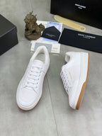 White low-top lace-up sneakers with gum-style sole and side logo