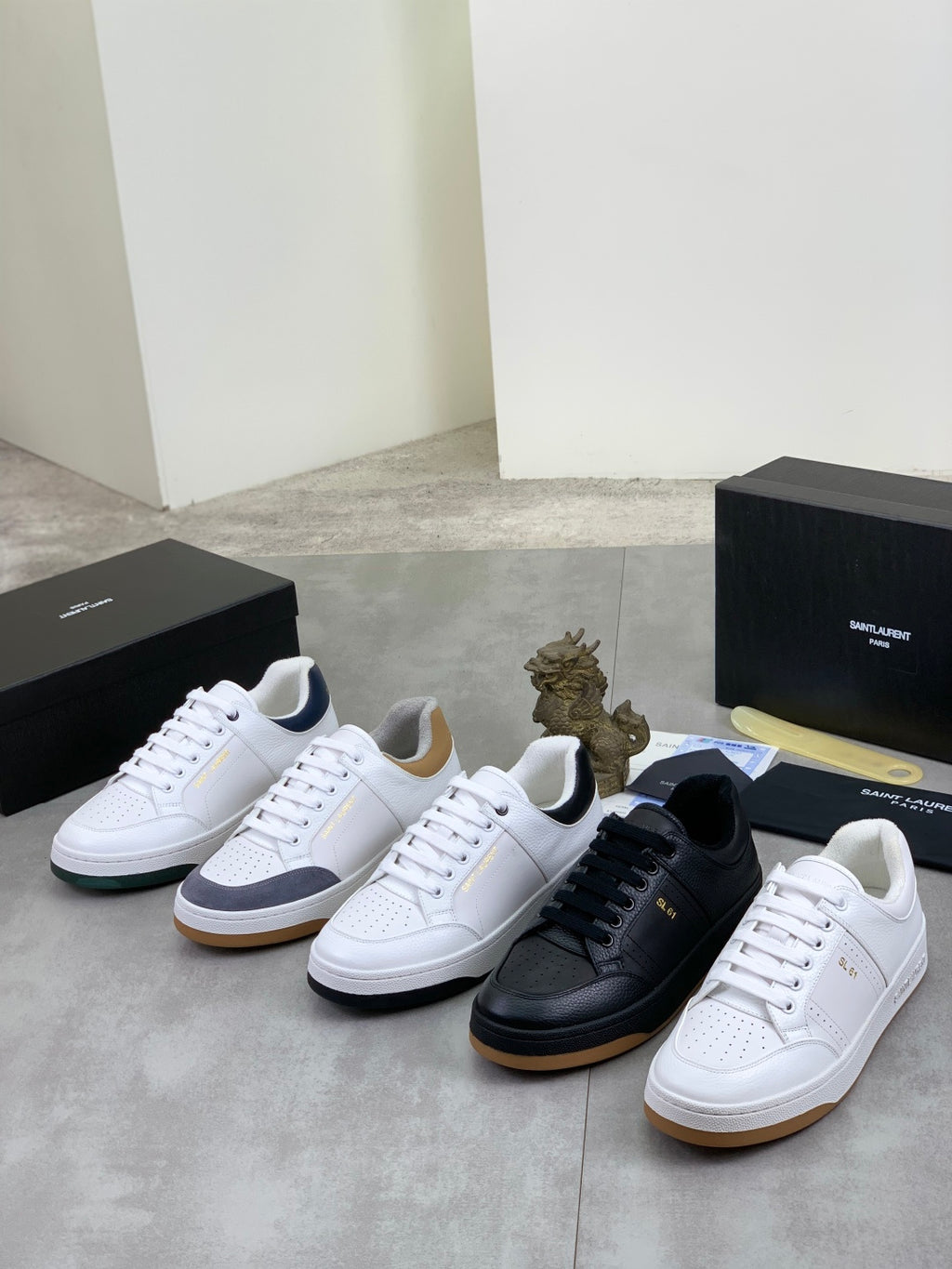 Unisex sneaker set with white, black, and light-colored pairs with low-top style