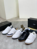Unisex sneaker set with white, black, and light-colored pairs with low-top style