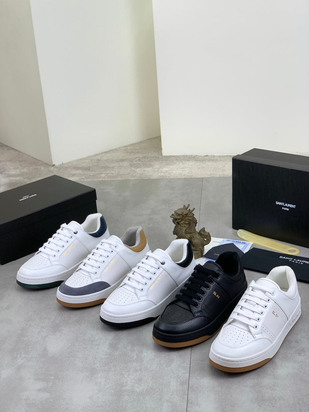 Unisex sneaker set with white, black, and light-colored pairs with low-top style
