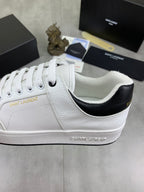White unisex sneaker with black collar lining and "SAINT LAURENT" side detail