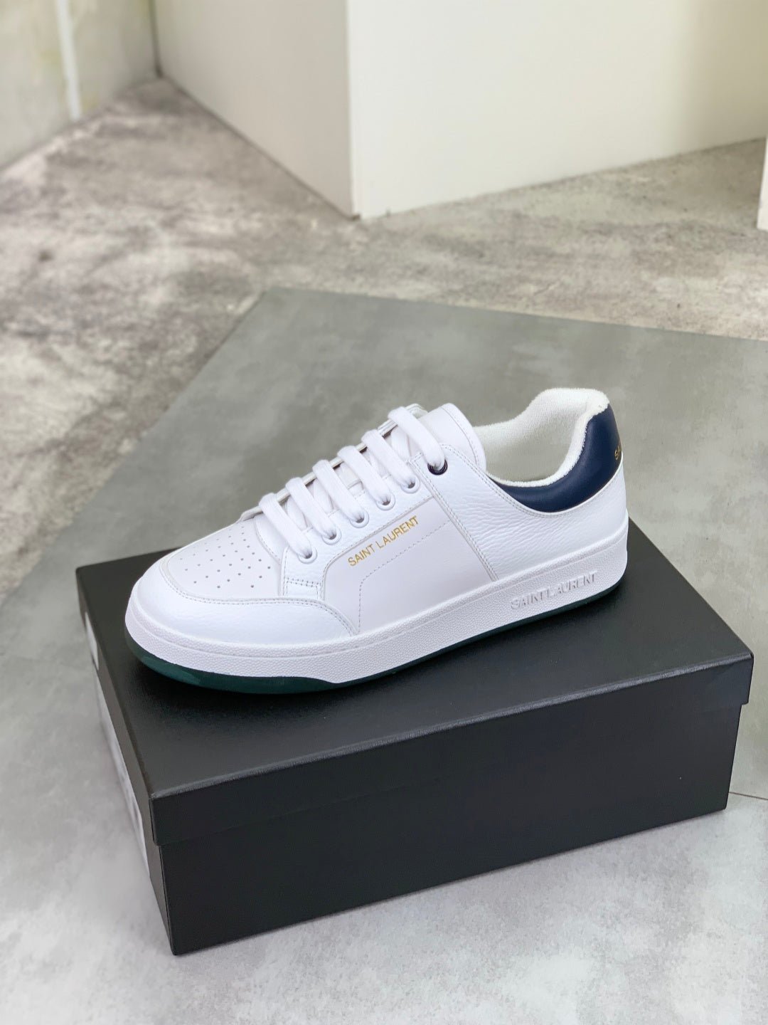 YSL unisex luxury shoes, white low-top sneakers with perforated toe and green sole trim