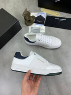 YSL unisex luxury shoes, pair of white sneakers with navy collar and green outsole edge