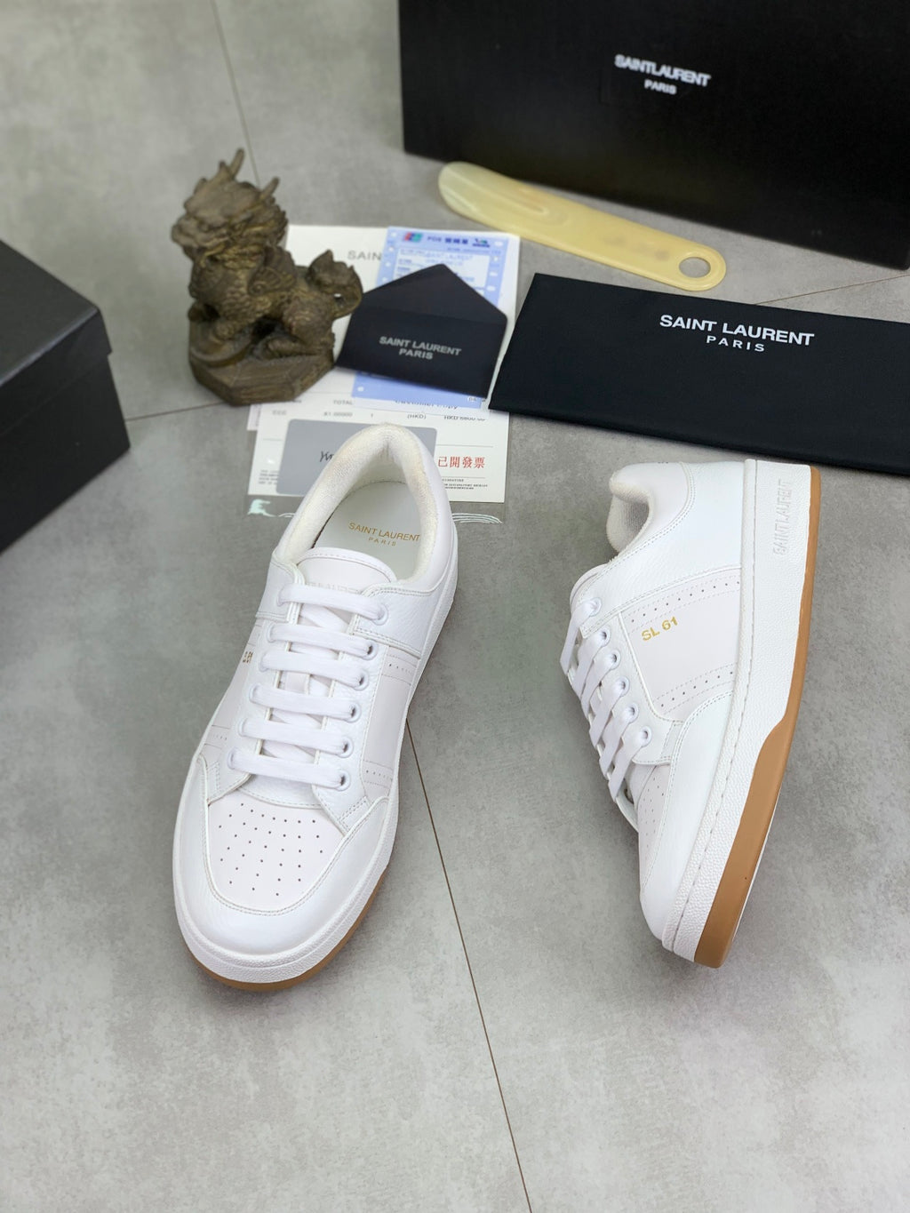 White leather lace-up sneakers with gum sole and logo tag on box
