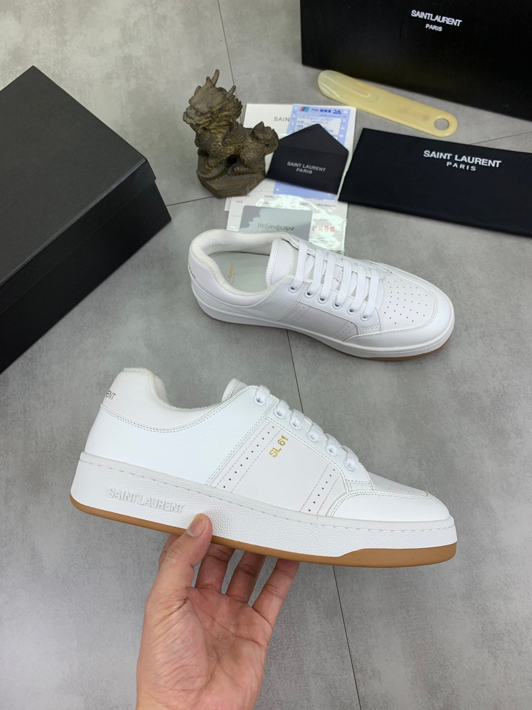 White lace-up sneakers with gum outsole and side logo detail
