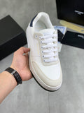Off-white leather sneaker with white laces and navy collar detail