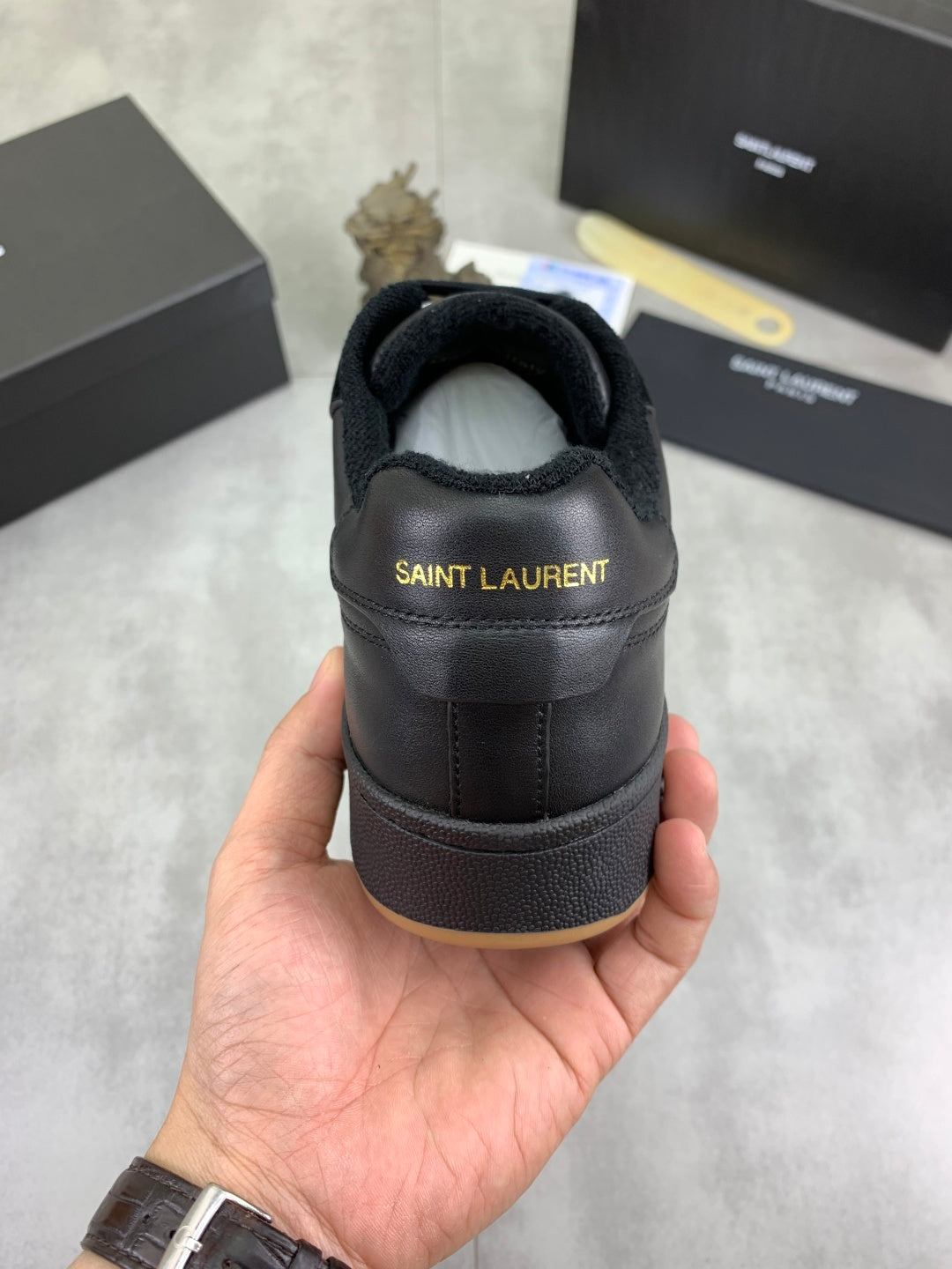 Black low-top sneakers heel with SAINT LAURENT logo on back collar