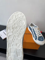 Louis Vuitton low-top sneakers showing white textured outsole with molded traction pattern