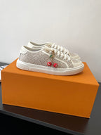 Louis Vuitton ladies lace-up sneakers, monogram canvas with gold eyelets and charms