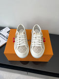 Louis Vuitton ladies lace-up sneakers, monogram canvas and white rubber sole